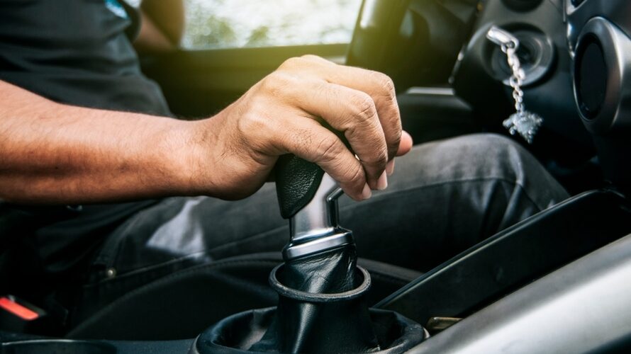 Concept,of,hand,grabbing,the,gear,lever,of,a,car